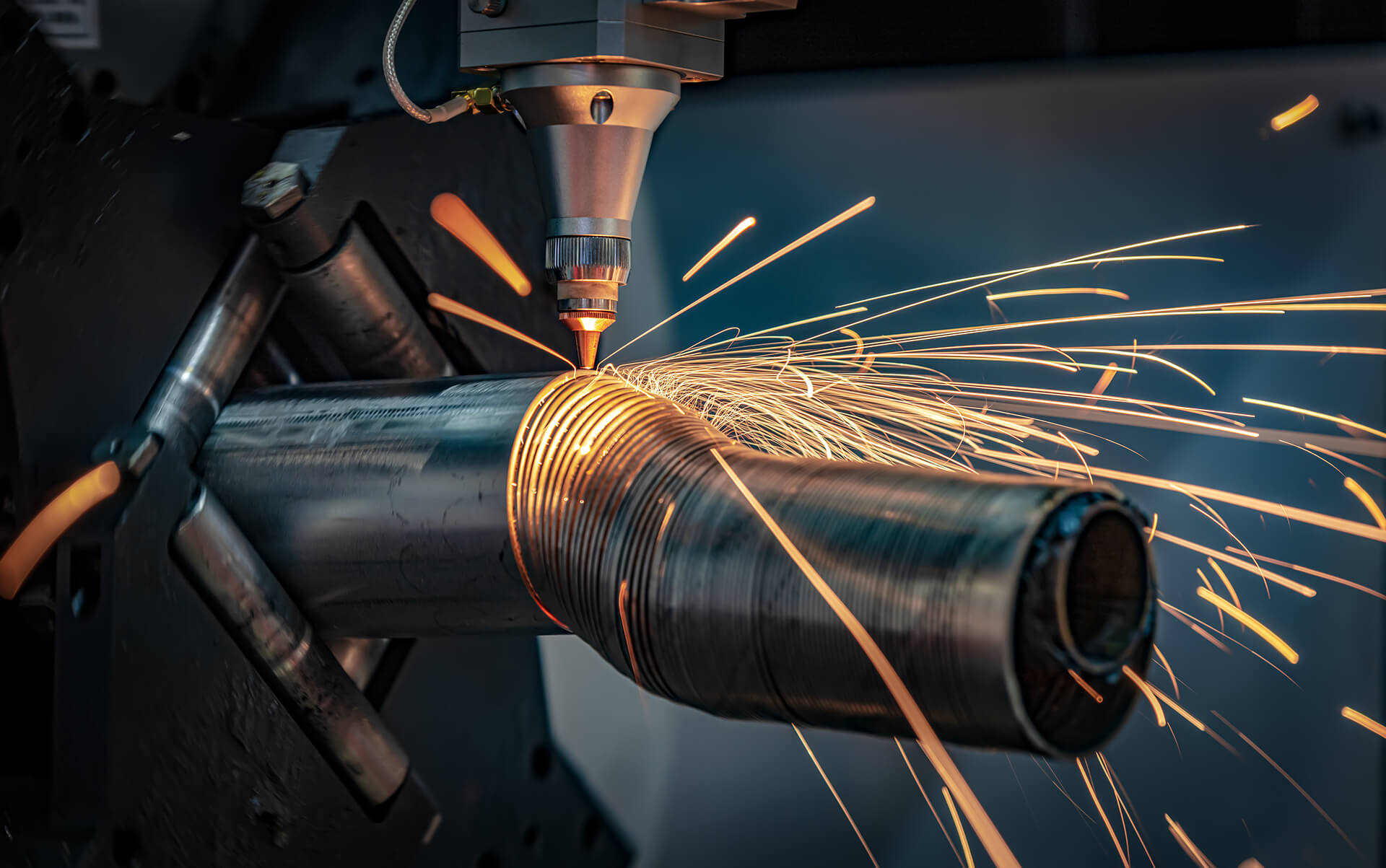 industrial-laser-cutting-sparks-on-metal-cylinder-2026-03-19-10-29-48-utc (1)